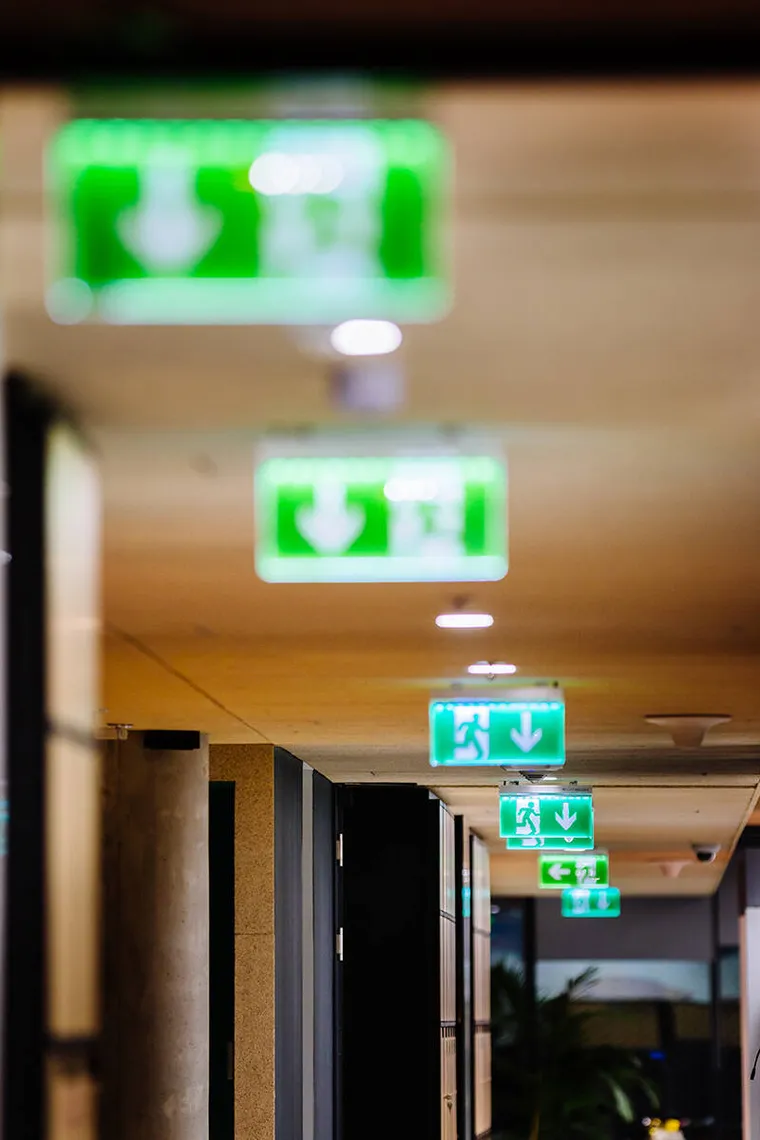 Commercial electrician completing service work for a business.
