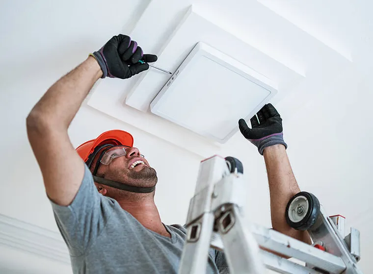 Electrician troubleshooting a residential electrical problem.